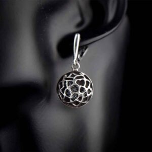 Handmade earrings with a moving spider inside